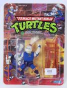 TEENAGE MUTANT NINJA TURTLES: An original vintage carded Playmates Teenage Mutant Ninja Turtles