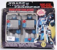 TRANSFORMERS: An original 1980's Hasbro made Transformers ' Walkie Talkie Combat Communicators ,