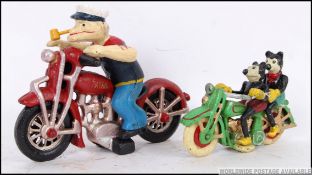 Two vintage style motorcycles. One red m