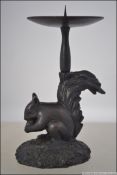 An unusual bronze pricket style candlest