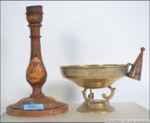 A late 19th century toll ware candlestic