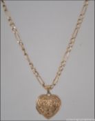 A 9ct gold figaro bar linked necklace an