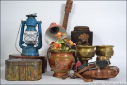 An interesting mixed lot to include lamps, tins, banjo, inlaid box,
