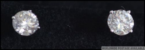 A pair of 14ct white gold ladies diamond