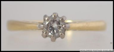 An 18ct gold and diamond single stone ri