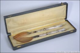 A silver handled early 20th century bone