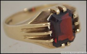 A vintage 9ct gold and cushion cut ruby