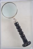 A vintage hand held magnifying glass hav