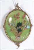 An early 20th century gilt framed floral