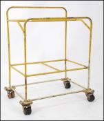 A mid century Industrial yellow metal ca