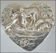 A silver hallmarked pill box in the form