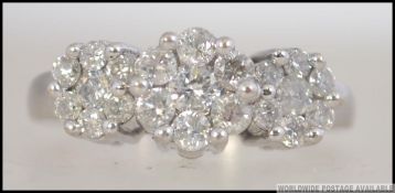 An 18ct white gold and cluster diamond