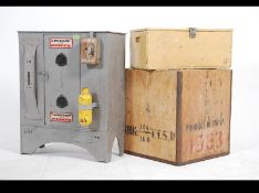 An unusual mid century painted pine workmans cabinet cupboard with applied Dunlop badges together