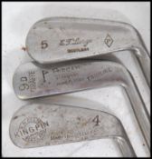 A collection of vintage golf clubs to include Mashie Niblick, Lane Crawford, Forgan, Harrods,