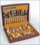 A mahogany cased canteen of cutlery by Arthur Price of Birmingham, England.