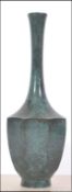 A 20th century brass Chinese vase of balauster form having marbled patternation design.