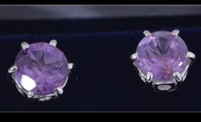 A pair of large silver and amethyst ladies earrings. Complete in the presentation box.