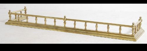 A late 19th century Victorian brass spindle gallery fire fender having spindle gallery over bar