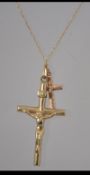 A 9ct gold hallmarked crucifix pendant and necklace chain together with an attached small cross