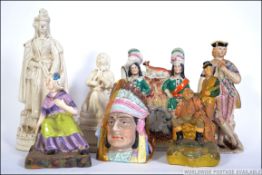 A collection of figurines to include a 19th century Staffordshire flatback,