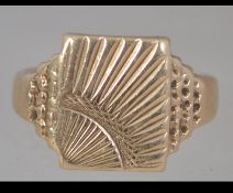A 9ct hallmarked gold signet ring having a sunburst design weighing 4.