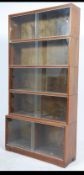 A 1950's mahogany lawyers stacking bookcase by Minty of Oxford.