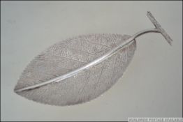 A believed Scandinavian silver leaf dish bearing makers initials FM and stamped silver. Weight 76.