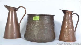A 19th century copper planter decorated in relief with deities along with a J.