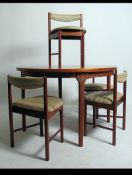 A 1960's retro 20th century Macintosh of Kirkcaldy teak dining suite comprising extending dining