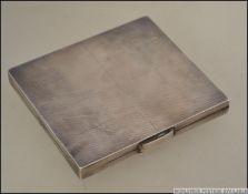 A stunning earlier part of the 20th century silver hallmarked cigarette case with stunning engine