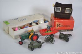 A bakelite viewmaster 3-d viewer together with die cast to include Dinky Field Artillery tractor,