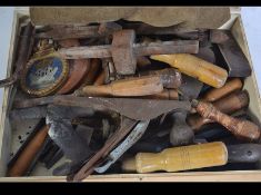 A collection of vintage wood working tools to include drill pieces, planes,