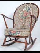 An Ercol beech and elm wood Windsor pattern rocking chair / armchair raised on sleigh runners with