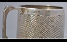 A silver hallmarked engine turned decorated Christening mug with Birmingham assay stamp,
