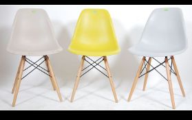 A set of three contemporary dining chairs in the manner of Eames style DSW chairs.