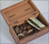 A small collection of late 19th century and later coins and notes all contained within a vintage