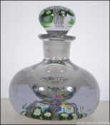 A lidded paperweight / scent bottle with candy twist and floral design. Measures: 11cms high.