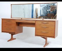 A mid 20th century teak Austinsuite low and long dressing table fitted with an central drawer with