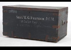 A vintage early 20th century military painted wooden metal bound steamer trunk chest with notation