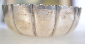 A silver hallmarked peanut dish of scalloped form. Marked for London 1944. Total weight 67.