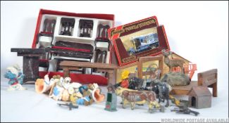 A mixed lot of toys to include dolls house furniture, vintage smurfs, Tetley Tea Folk,