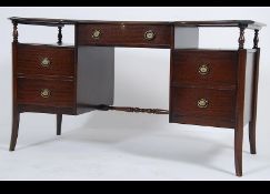 A mid century mahogany and leather office desk together with a matching leather desk chair.