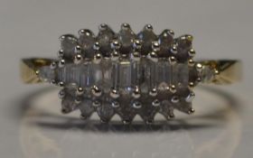 A 9ct gold and diamond cluster ring set with 50pts round and marquise cut diamonds in a prong