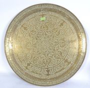 A large brass Islamic table top brass tray with central geometric design of Ottoman design with