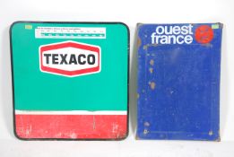 Two vintage 20th century metal advertising signs to include Ouest France and a Texaco Petroleum