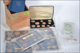 A collection of coins to include decimal sets, commemorative coins, silver,