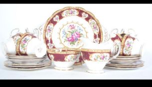 A six person China tea service by Royal Albert in the ' Lady Hamilton ' pattern.