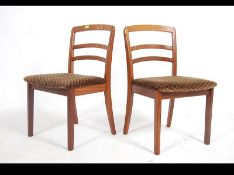 A pair of retro 20th century 1970's G - Plan teak wood rail back dining chairs with drop in seat
