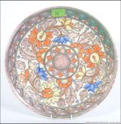 A Charlotte Rhead for Crown Ducal wall plaque, circa 1938-1940, decorated in pattern 5983,