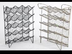 A pair of mid century Industrial wire work wine bottle racks having shaped and angled racks,